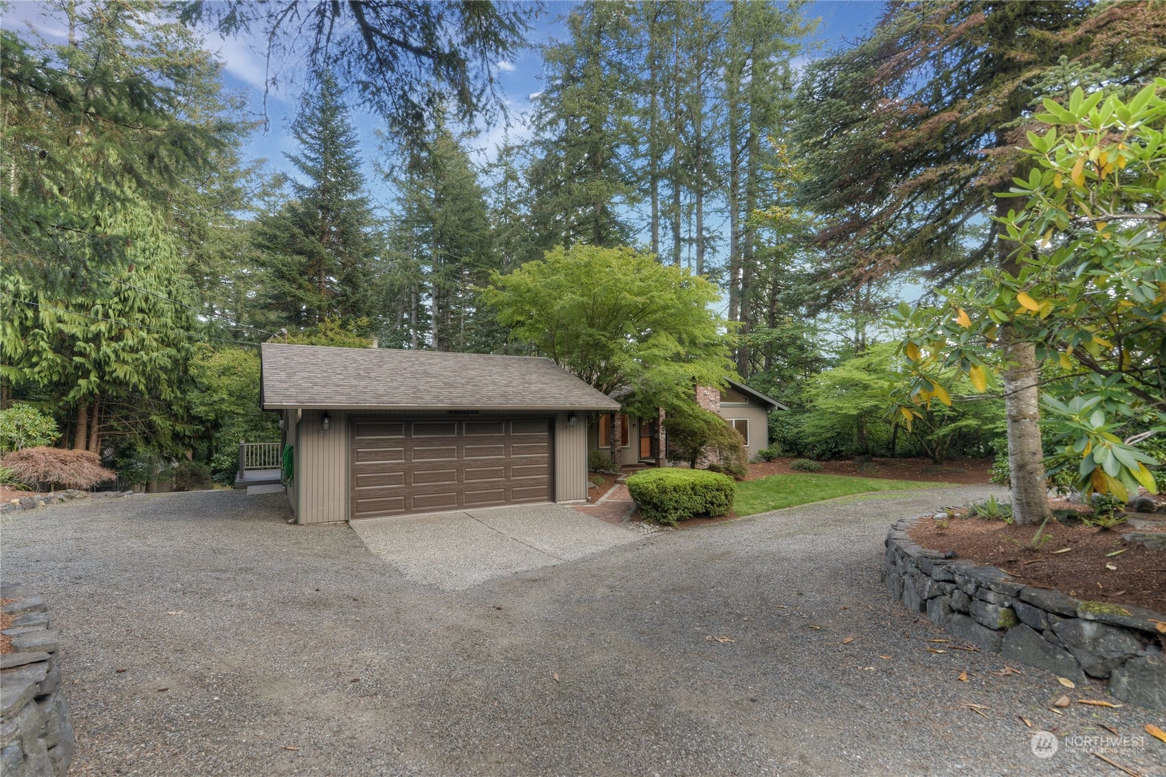 6120 Delphi Road Southwest Olympia, WA 98512 - Photo 2 of 40 a house with trees in the background