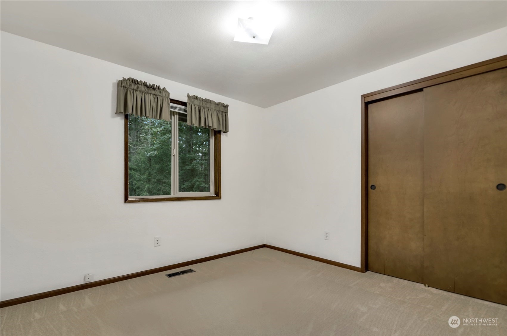 6120 Delphi Road Southwest Olympia, WA 98512 - Photo 23 of 40 an empty room with a window