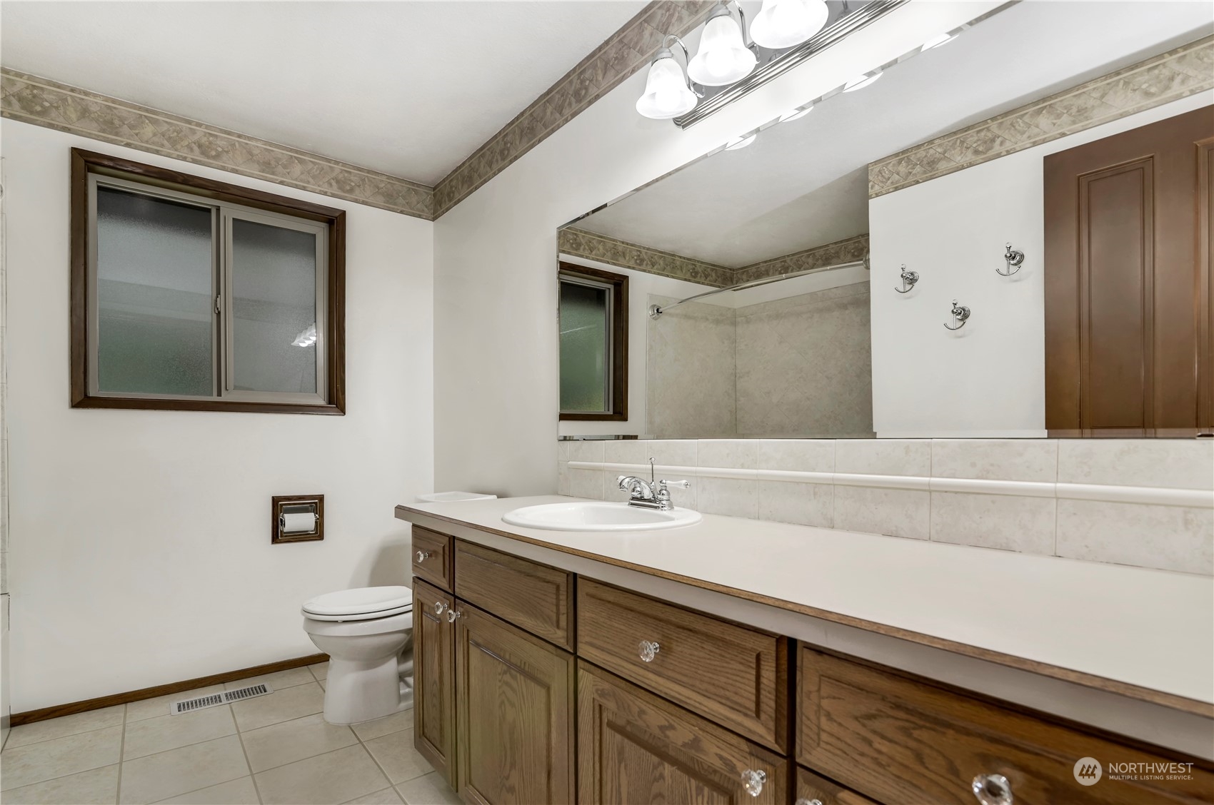 6120 Delphi Road Southwest Olympia, WA 98512 - Photo 24 of 40 a bathroom with a sink a toilet and mirror
