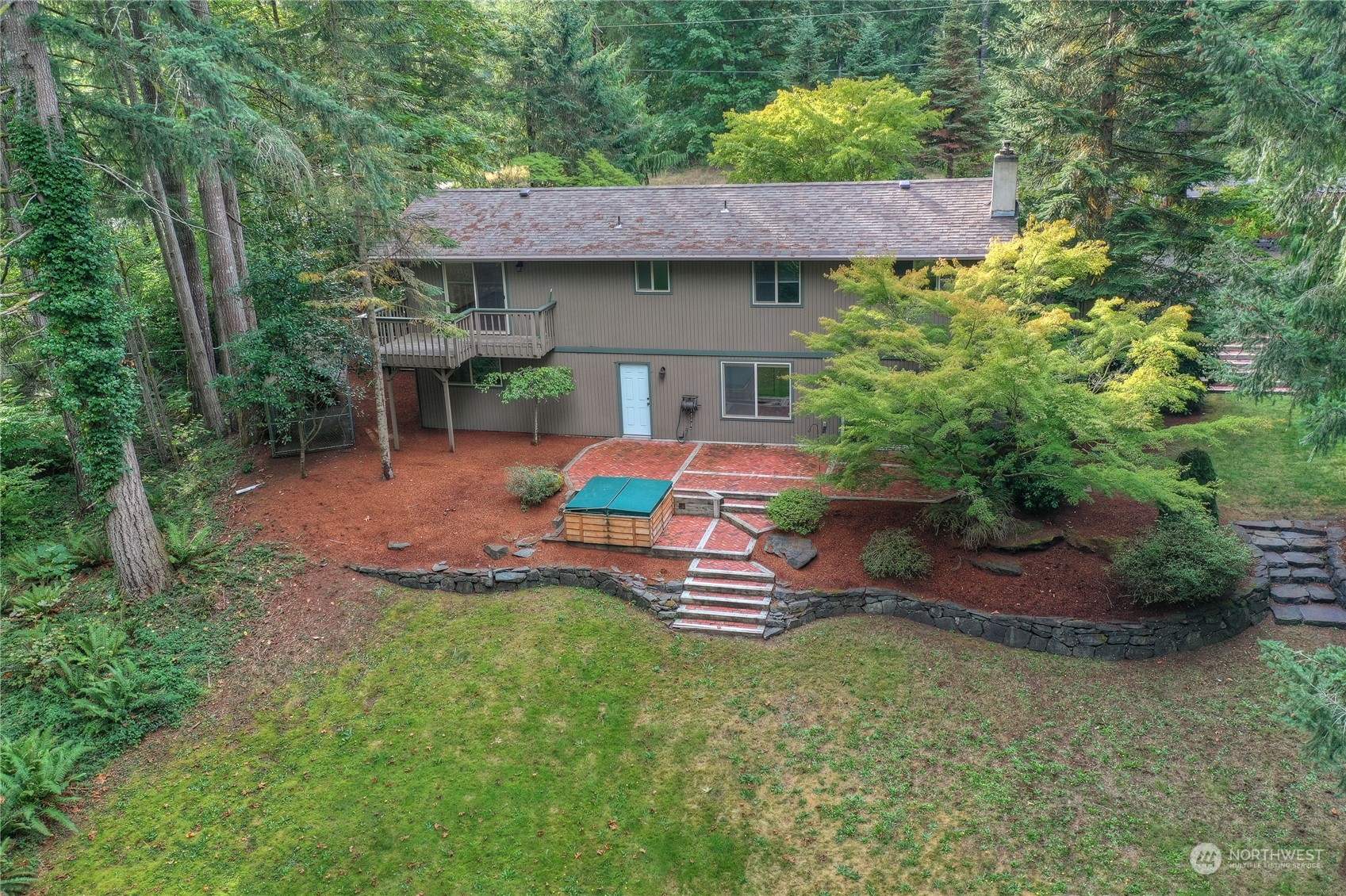 6120 Delphi Road Southwest Olympia, WA 98512 - Photo 32 of 40 a front view of a house with a garden and porch