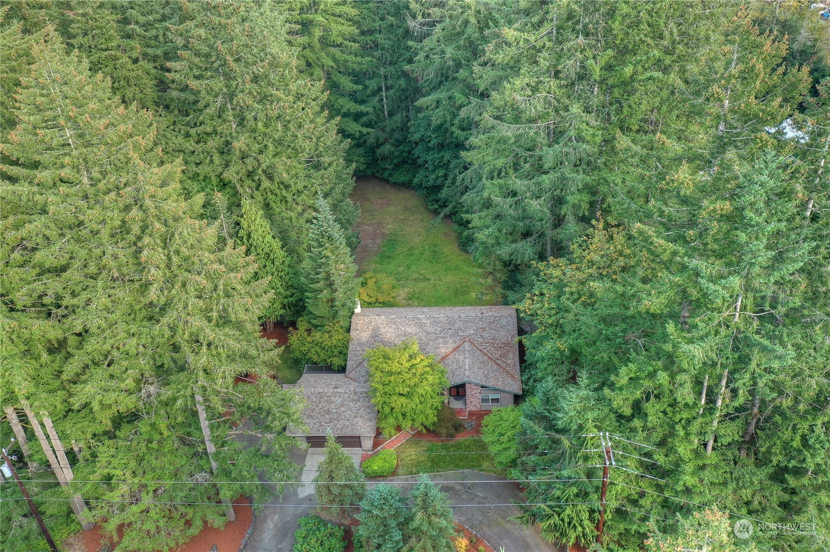6120 Delphi Road Southwest Olympia, WA 98512 - Photo 33 of 40 an aerial view of a house with outdoor space and trees all around
