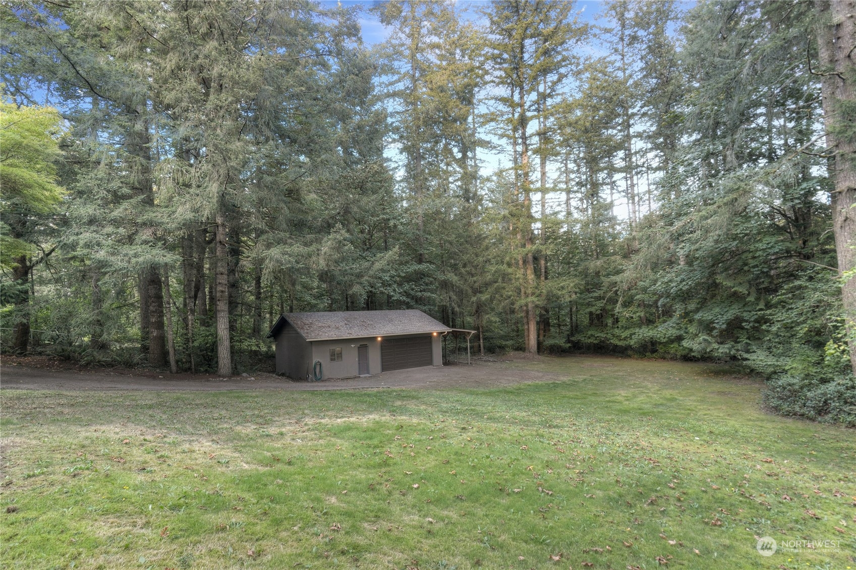 6120 Delphi Road Southwest Olympia, WA 98512 - Photo 37 of 40 a backyard of a house with trees and entertaining space
