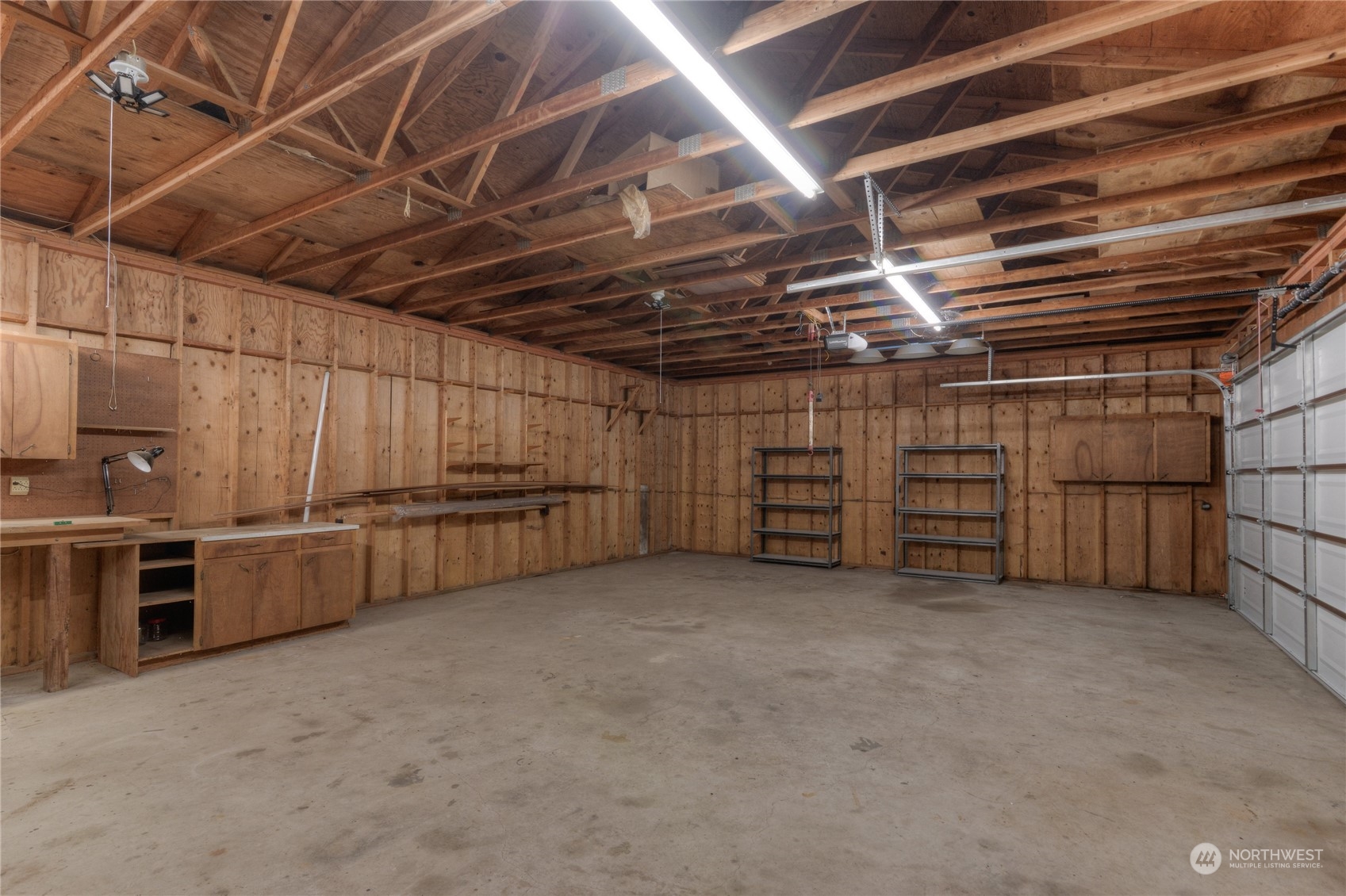 6120 Delphi Road Southwest Olympia, WA 98512 - Photo 4 of 40 a view of a garage room with racks