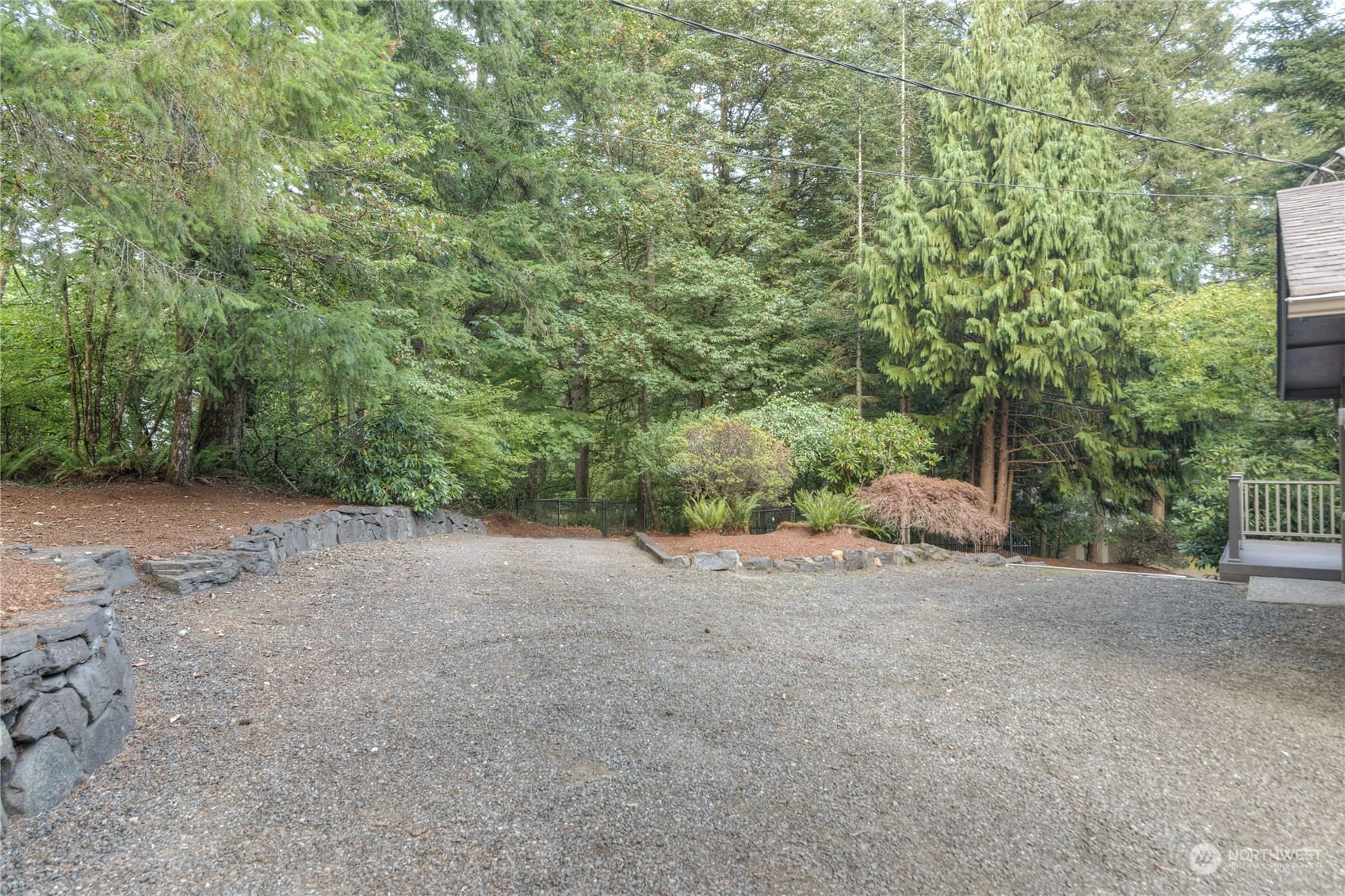 6120 Delphi Road Southwest Olympia, WA 98512 - Photo 5 of 40 a view of a dirt road and trees in the background