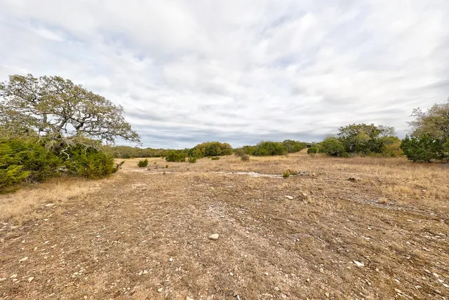 a view of a lake with green space