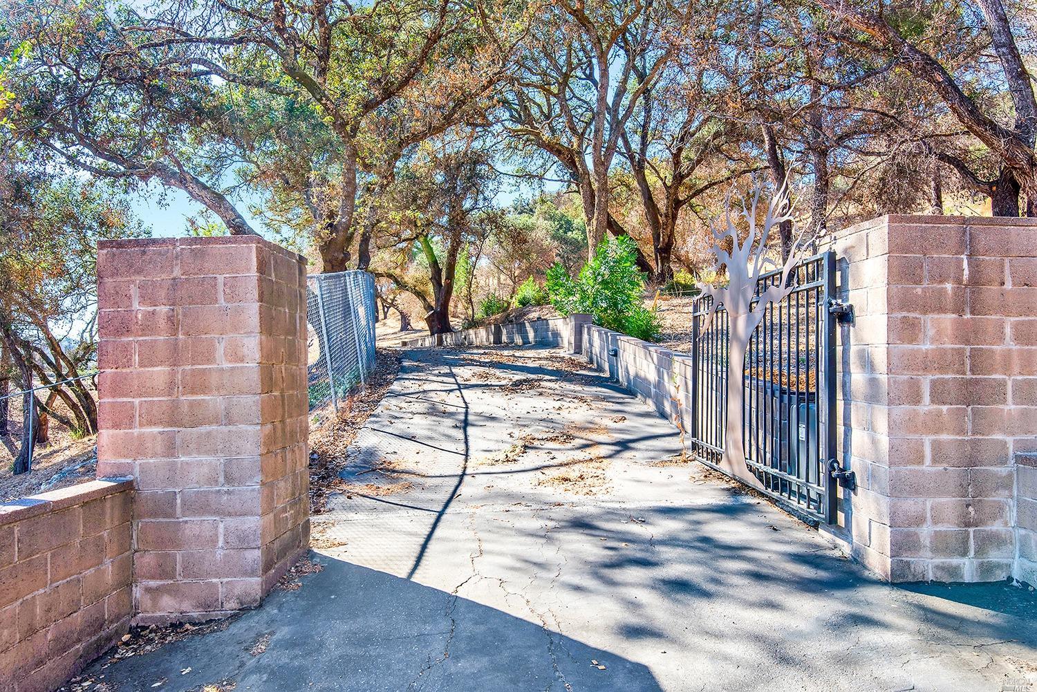 3755 Porter Creek Road Santa Rosa, CA 95404 - Photo 1 of 1 a view of a pathway with a wrought fence