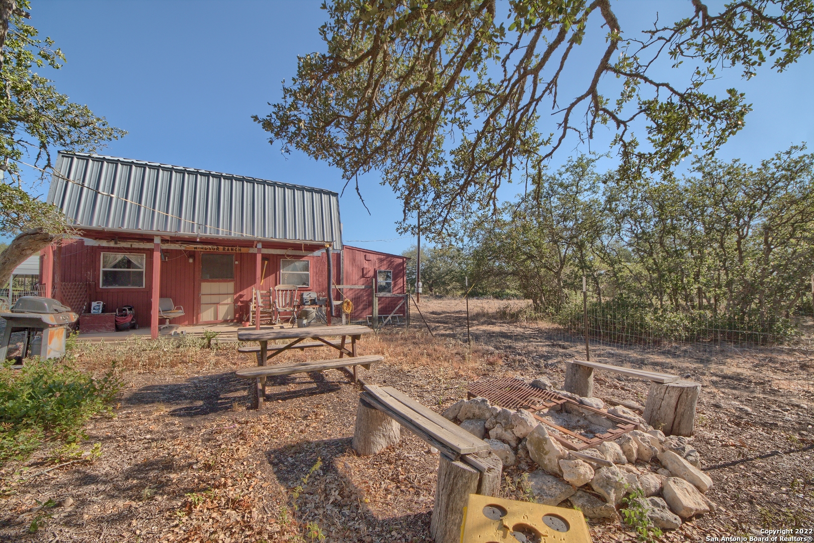 465 Watkins Road Mountain Home, TX 78058 - Photo 14 of 56 a view of a house with backyard and sitting area