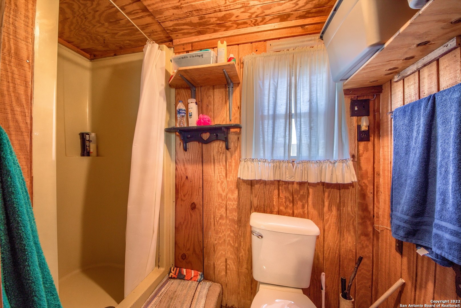 465 Watkins Road Mountain Home, TX 78058 - Photo 19 of 56 a bathroom with a toilet and a shower