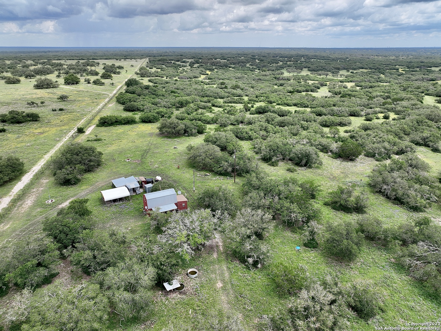 465 Watkins Road Mountain Home, TX 78058 - Photo 2 of 56 a view of a lake with a houses