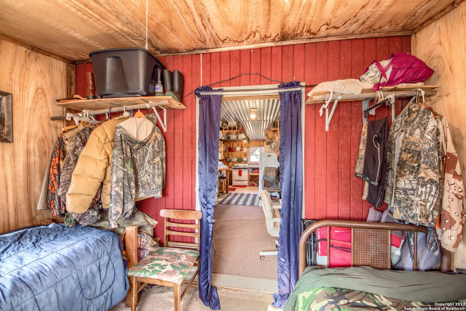 465 Watkins Road Mountain Home, TX 78058 - Photo 26 of 56 a view of walk in closet with clothes