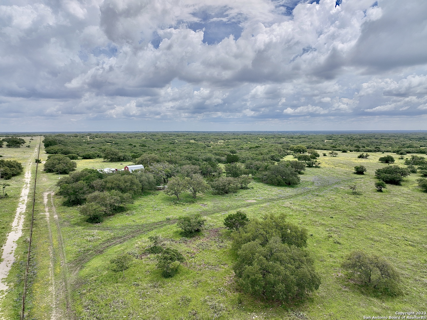 465 Watkins Road Mountain Home, TX 78058 - Photo 4 of 56 a view of a big yard with lots of green space
