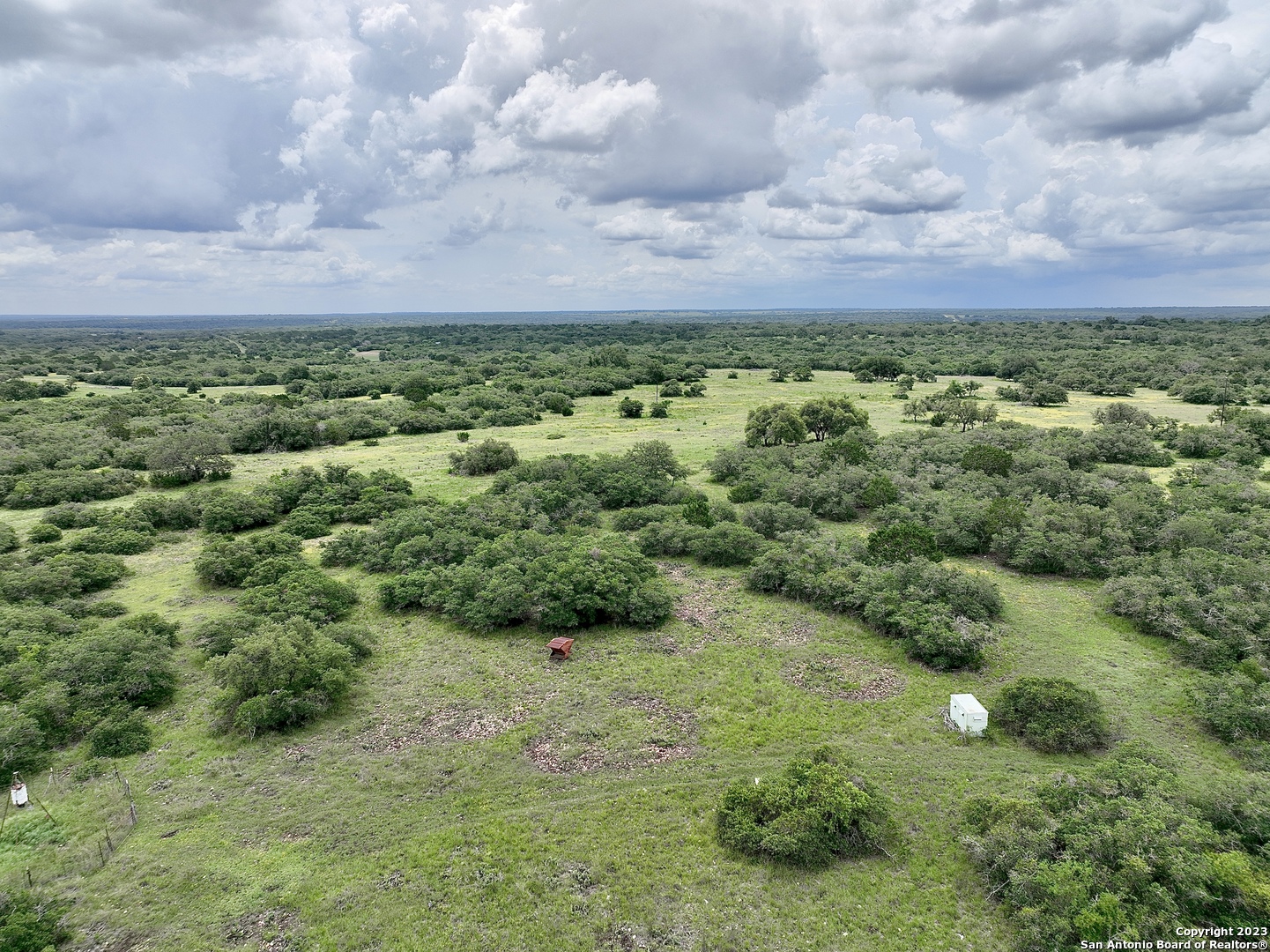 465 Watkins Road Mountain Home, TX 78058 - Photo 48 of 56 a view of a green field with lots of bushes