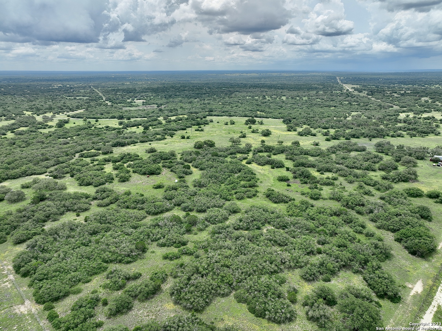465 Watkins Road Mountain Home, TX 78058 - Photo 7 of 56 a view of a green field