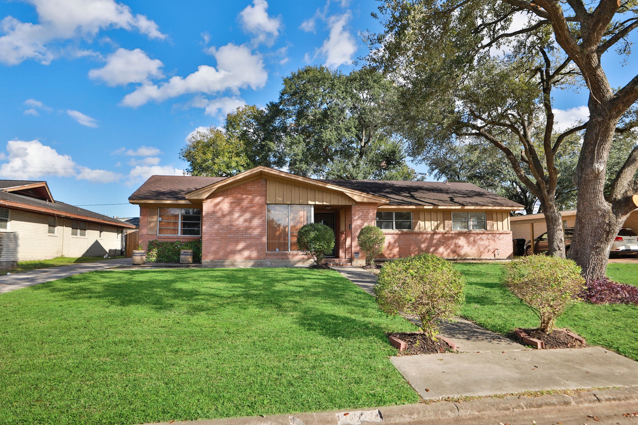 8235 Dover Street Houston, TX 77061 - Photo 2 of 36 a front view of a house with a garden
