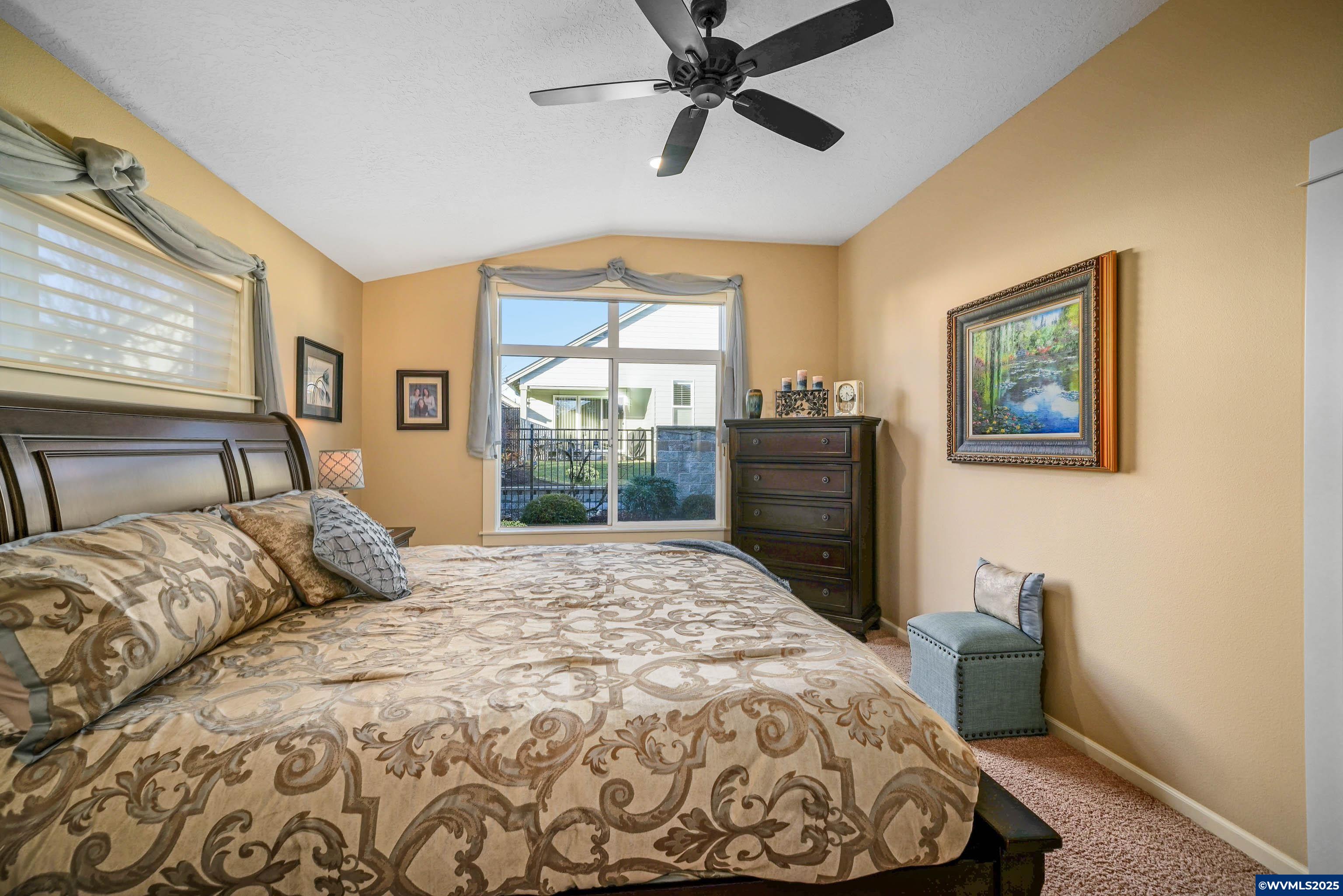 2224 Southeast Rhododendron Avenue Dallas, OR 97338 - Photo 29 of 38 a bedroom with a large bed and a window