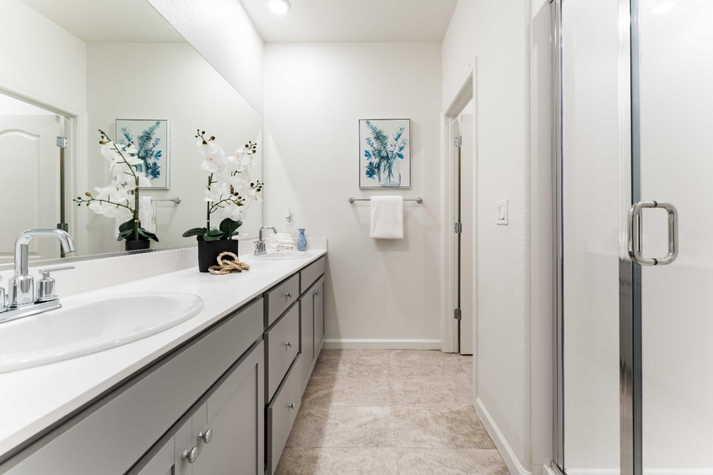 25353 Custom Drive Hayward, CA 94544 - Photo 18 of 32 a bathroom with a double vanity sink a mirror and shower