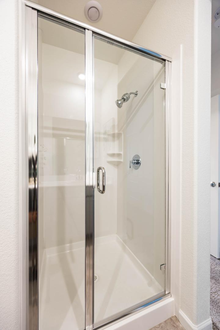 25353 Custom Drive Hayward, CA 94544 - Photo 19 of 32 a bathroom with a glass shower door
