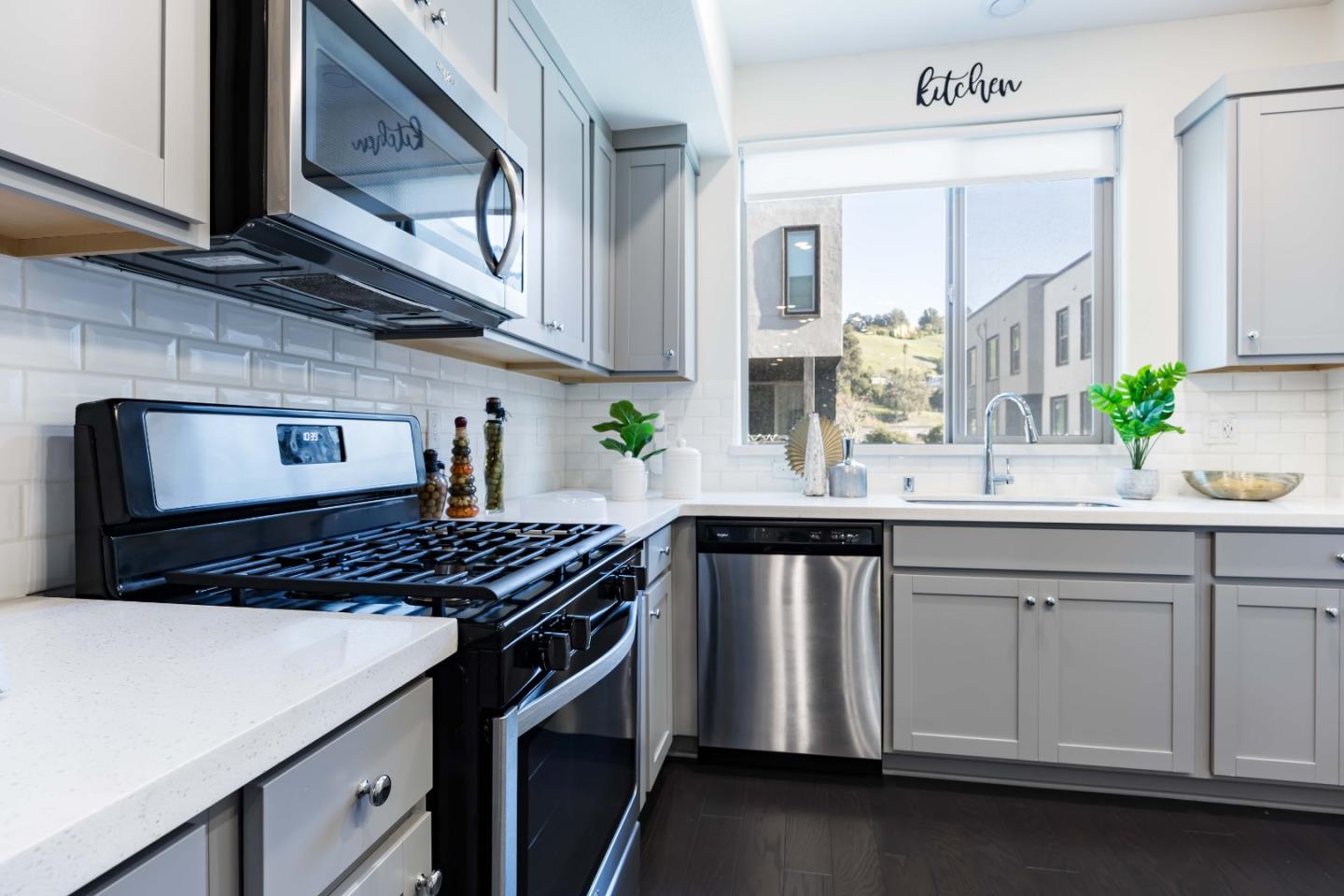 25353 Custom Drive Hayward, CA 94544 - Photo 2 of 32 a kitchen with stainless steel appliances a sink dishwasher stove and cabinets
