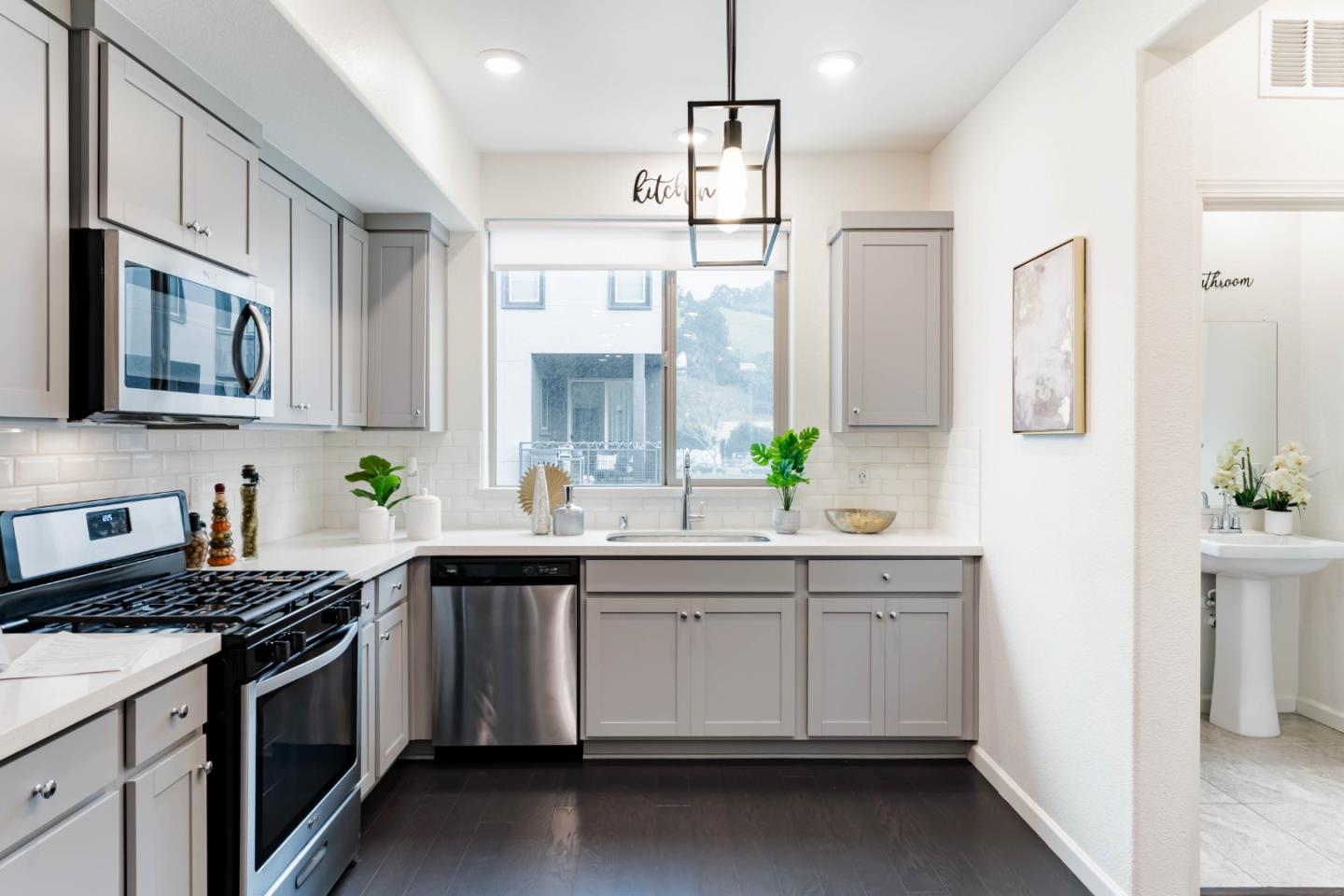 25353 Custom Drive Hayward, CA 94544 - Photo 4 of 32 a kitchen with a sink stove and microwave