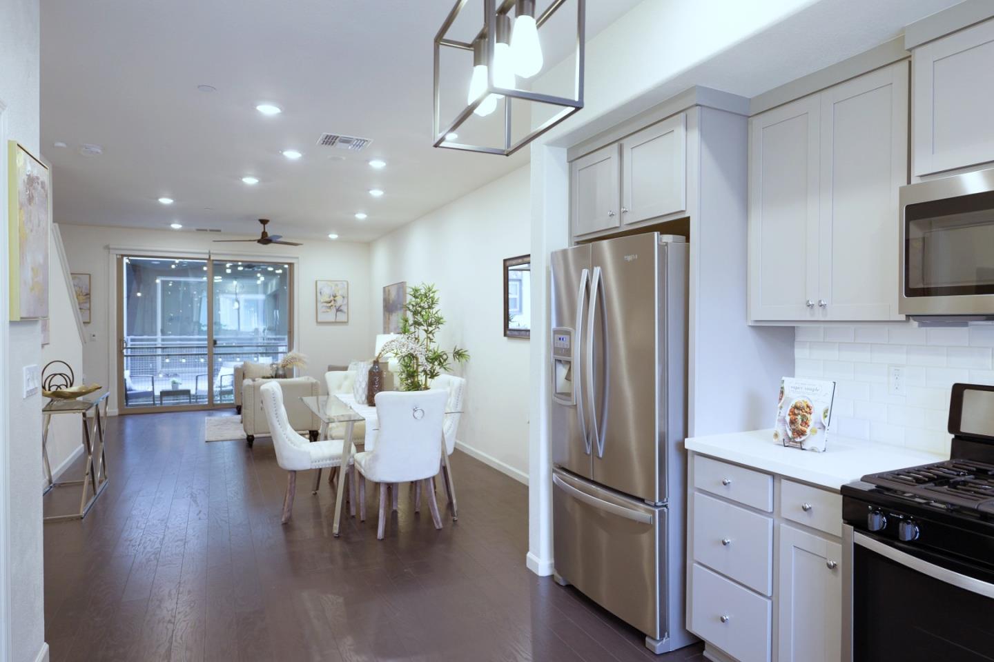 25353 Custom Drive Hayward, CA 94544 - Photo 7 of 32 a kitchen with stainless steel appliances granite countertop a refrigerator and microwave