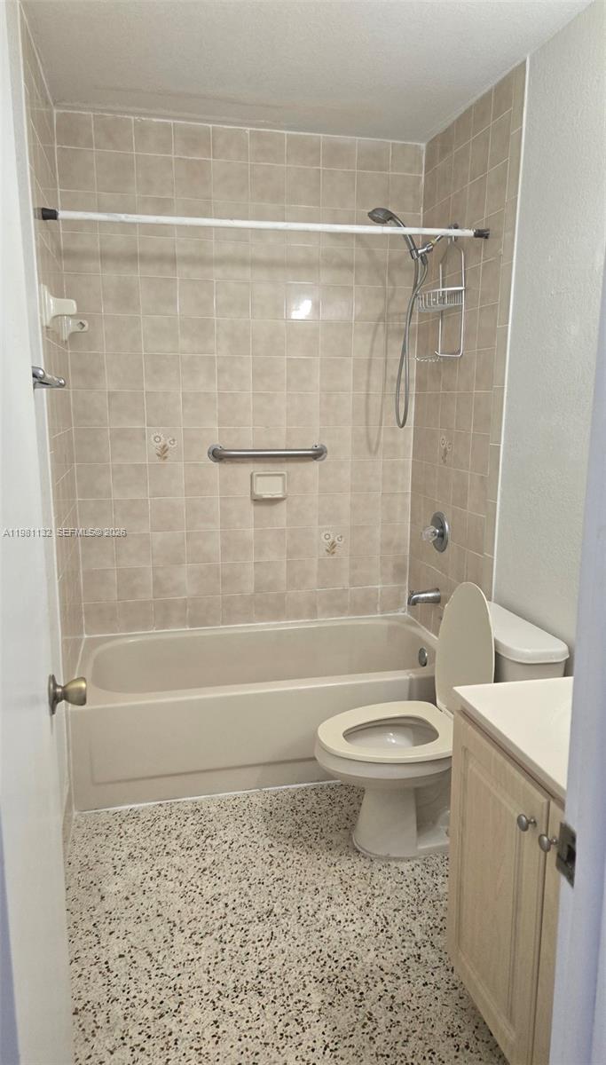 142 Southwest 18th Avenue, Unit 30 Miami, FL 33135 - Photo 4 of 11 a bathroom with a toilet a sink and a bathtub
