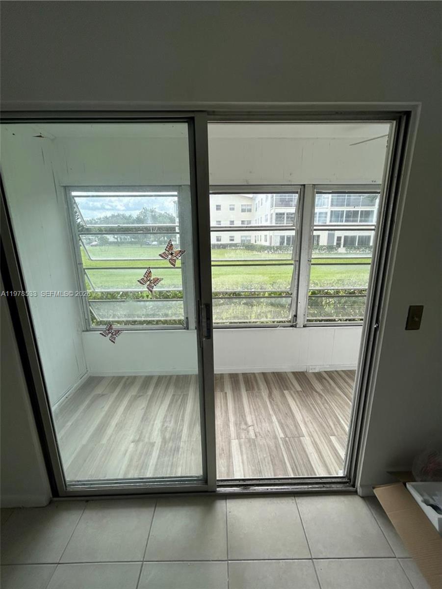 550 Mansfield M, Unit 550 Boca Raton, FL 33434 - Photo 11 of 30 a view of room with window and refrigerator