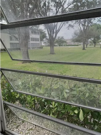 a view of a wooden fence from a window