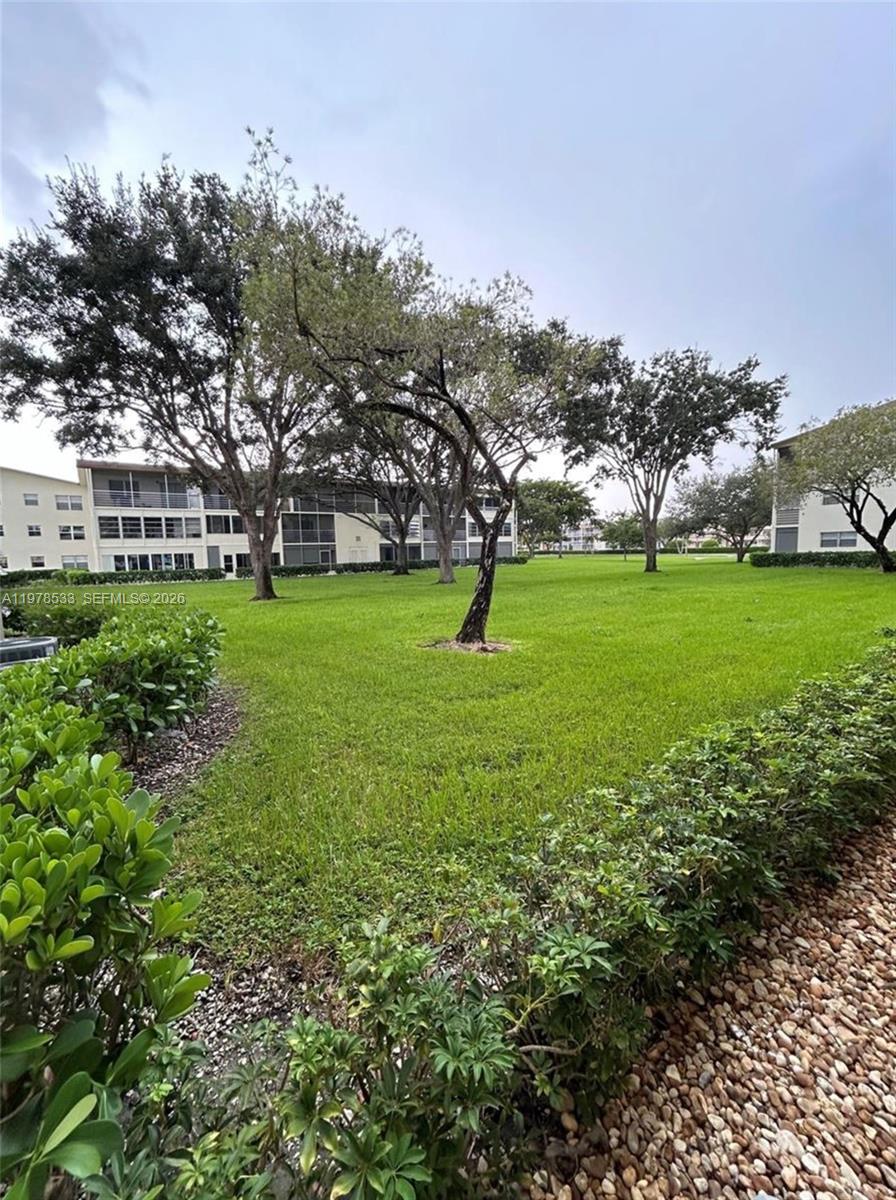 550 Mansfield M, Unit 550 Boca Raton, FL 33434 - Photo 17 of 30 a view of field with trees in the background