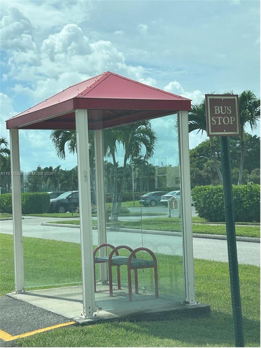 550 Mansfield M, Unit 550 Boca Raton, FL 33434 - Photo 18 of 30 a view of a deck with a yard