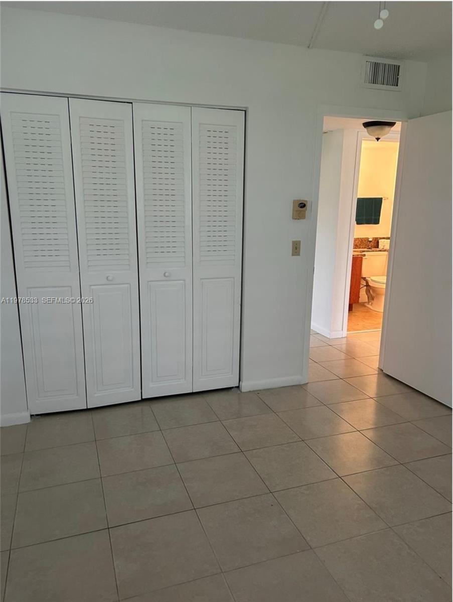 550 Mansfield M, Unit 550 Boca Raton, FL 33434 - Photo 22 of 30 a view of a room with a hallway