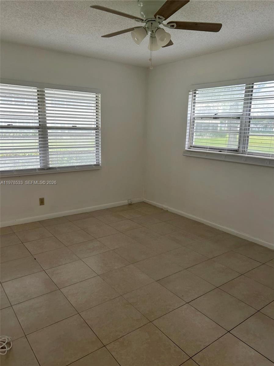 550 Mansfield M, Unit 550 Boca Raton, FL 33434 - Photo 26 of 30 a view of an empty room with a window