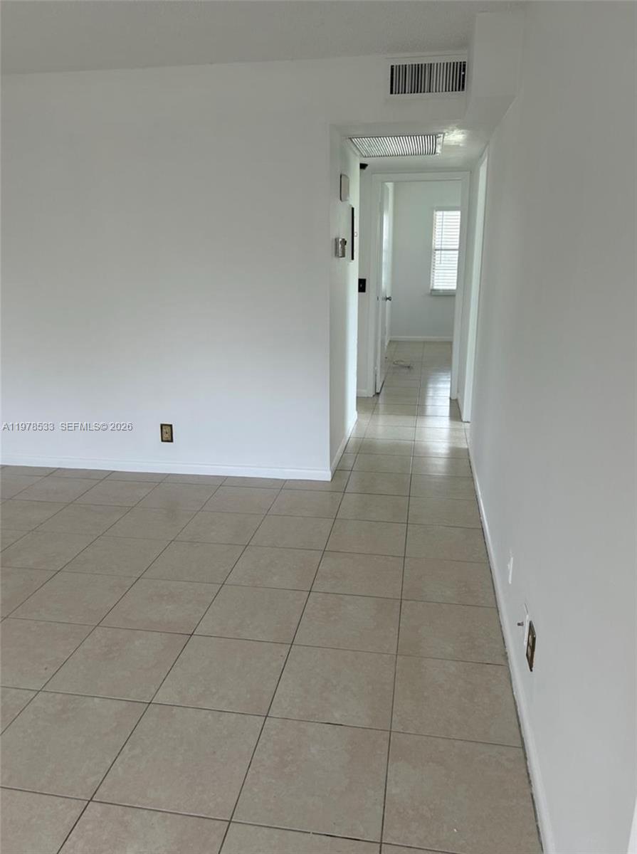 550 Mansfield M, Unit 550 Boca Raton, FL 33434 - Photo 7 of 30 a view of a hallway with closet