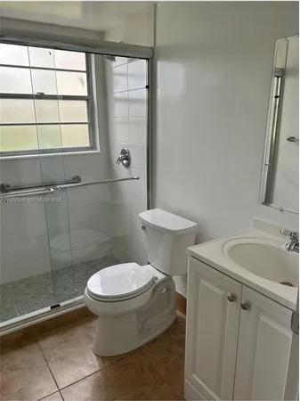 a bathroom with a toilet and a sink