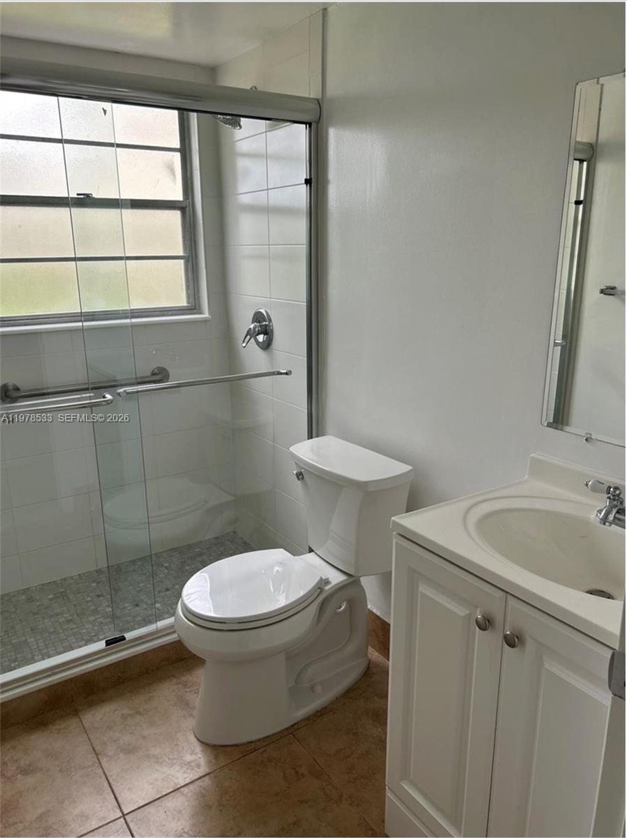 550 Mansfield M, Unit 550 Boca Raton, FL 33434 - Photo 8 of 30 a bathroom with a toilet and a sink