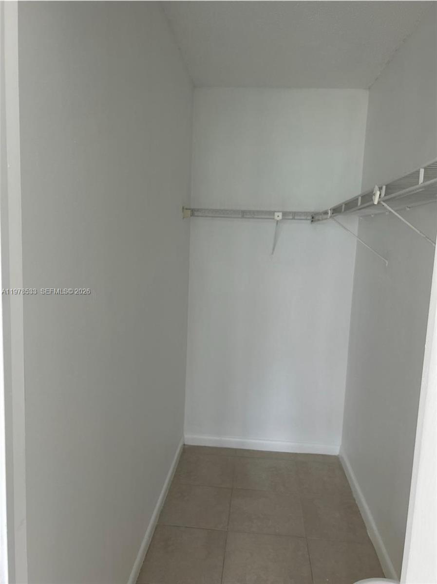 550 Mansfield M, Unit 550 Boca Raton, FL 33434 - Photo 10 of 30 a view of an empty walk in closet