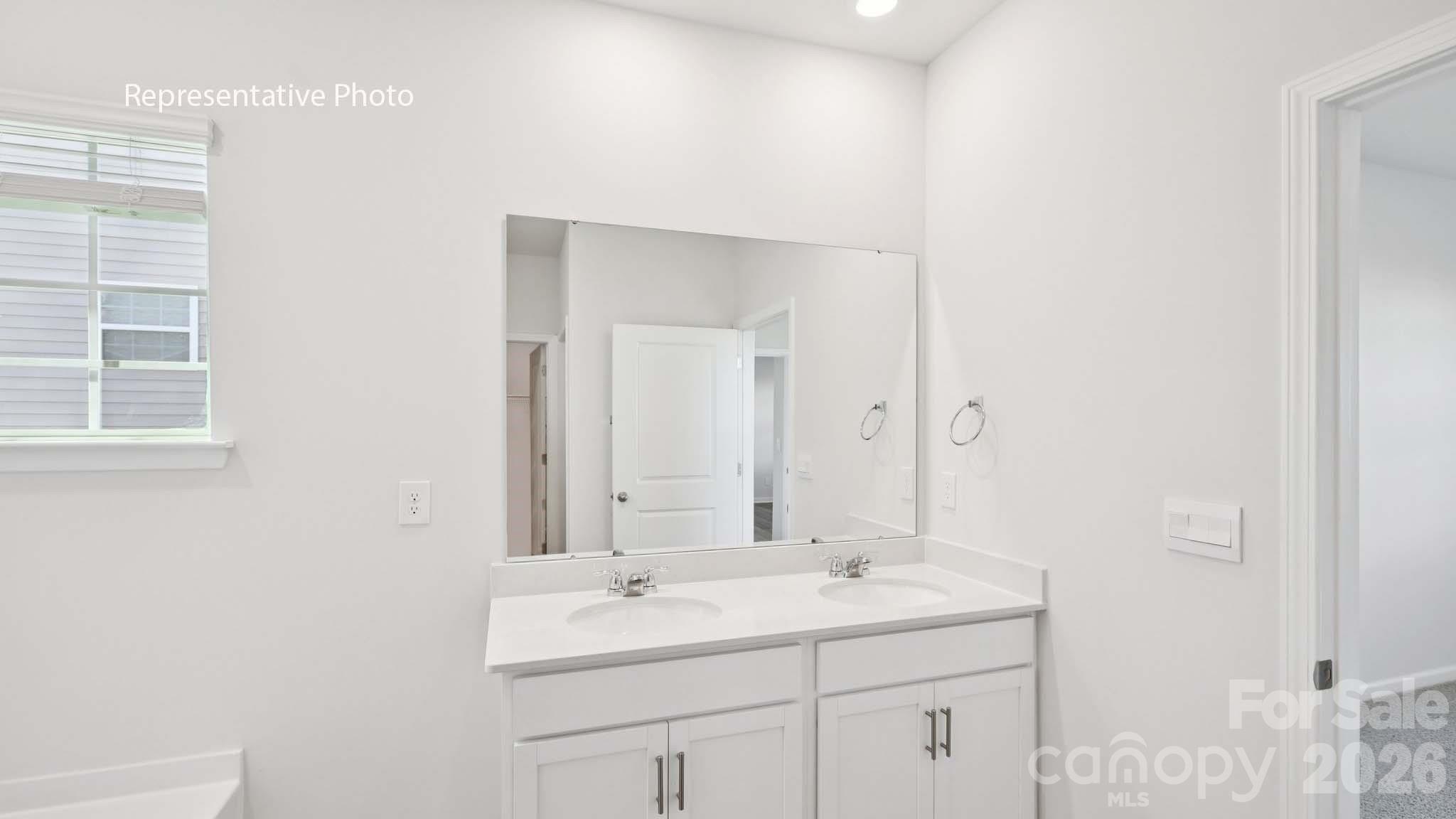 2019 Moorside Court Lancaster, SC 29720 - Photo 18 of 21 a bathroom with double sink and a mirror