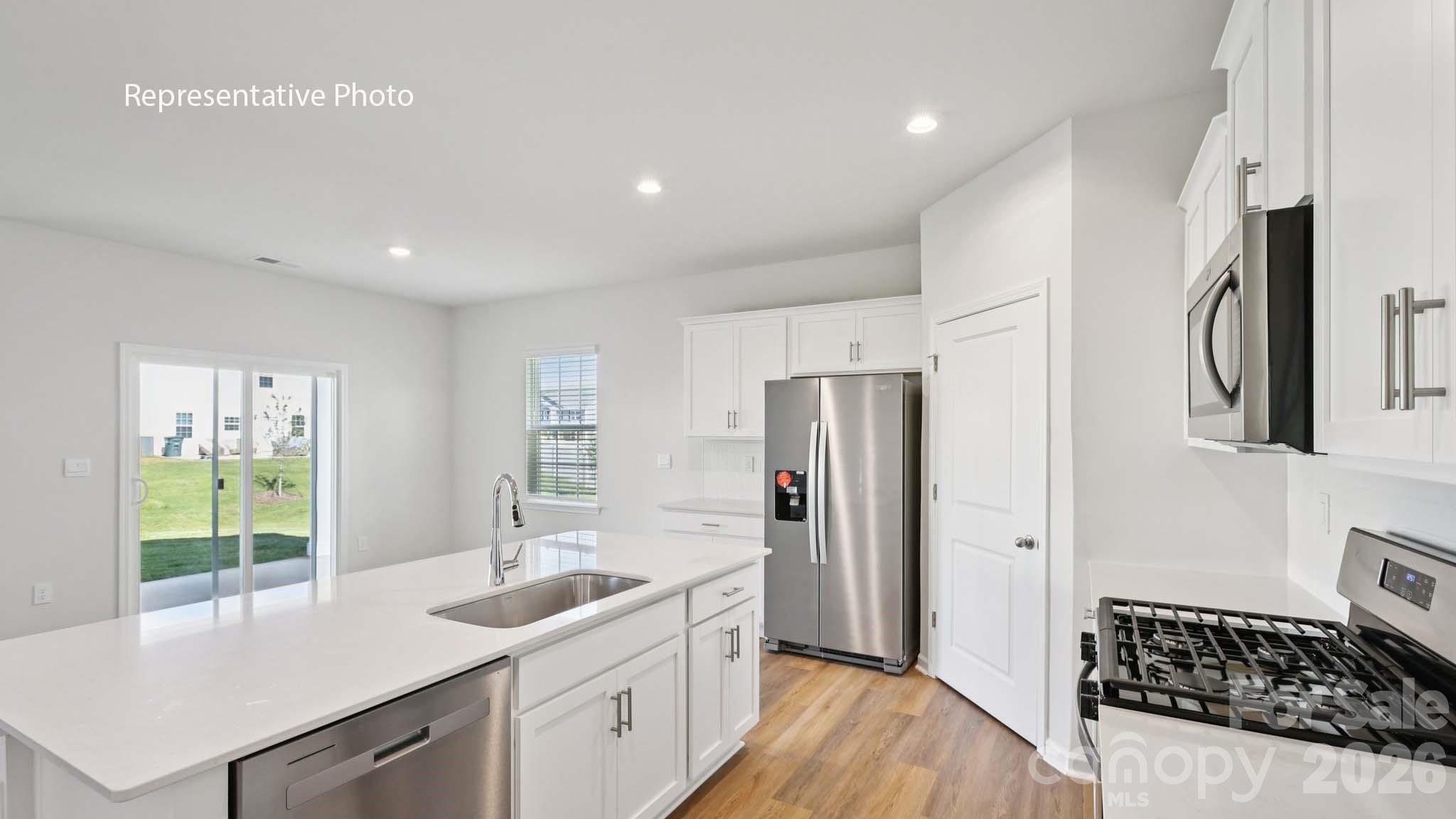 2019 Moorside Court Lancaster, SC 29720 - Photo 4 of 21 a kitchen with stainless steel appliances a sink stove and refrigerator