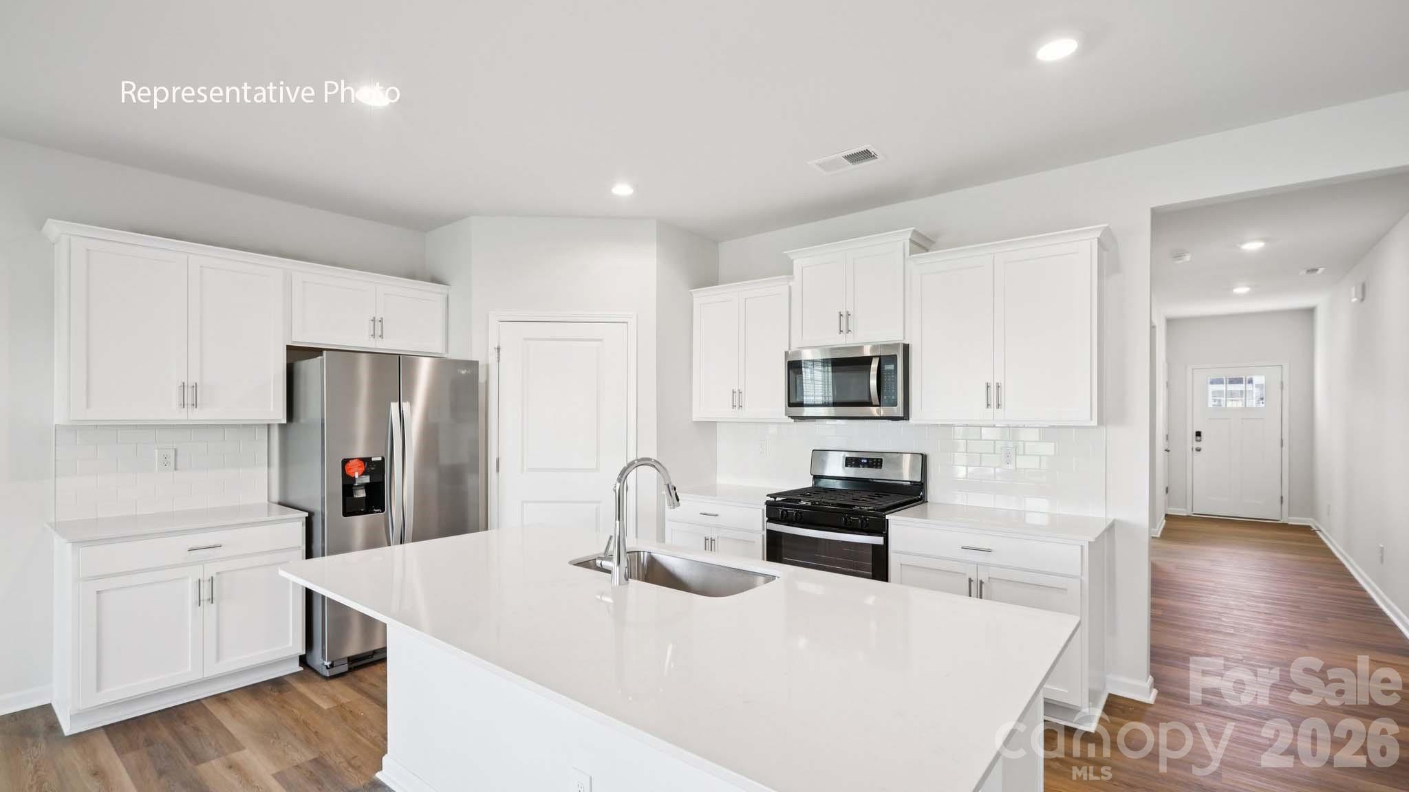 2019 Moorside Court Lancaster, SC 29720 - Photo 6 of 21 a kitchen with stainless steel appliances granite countertop a sink stove and refrigerator