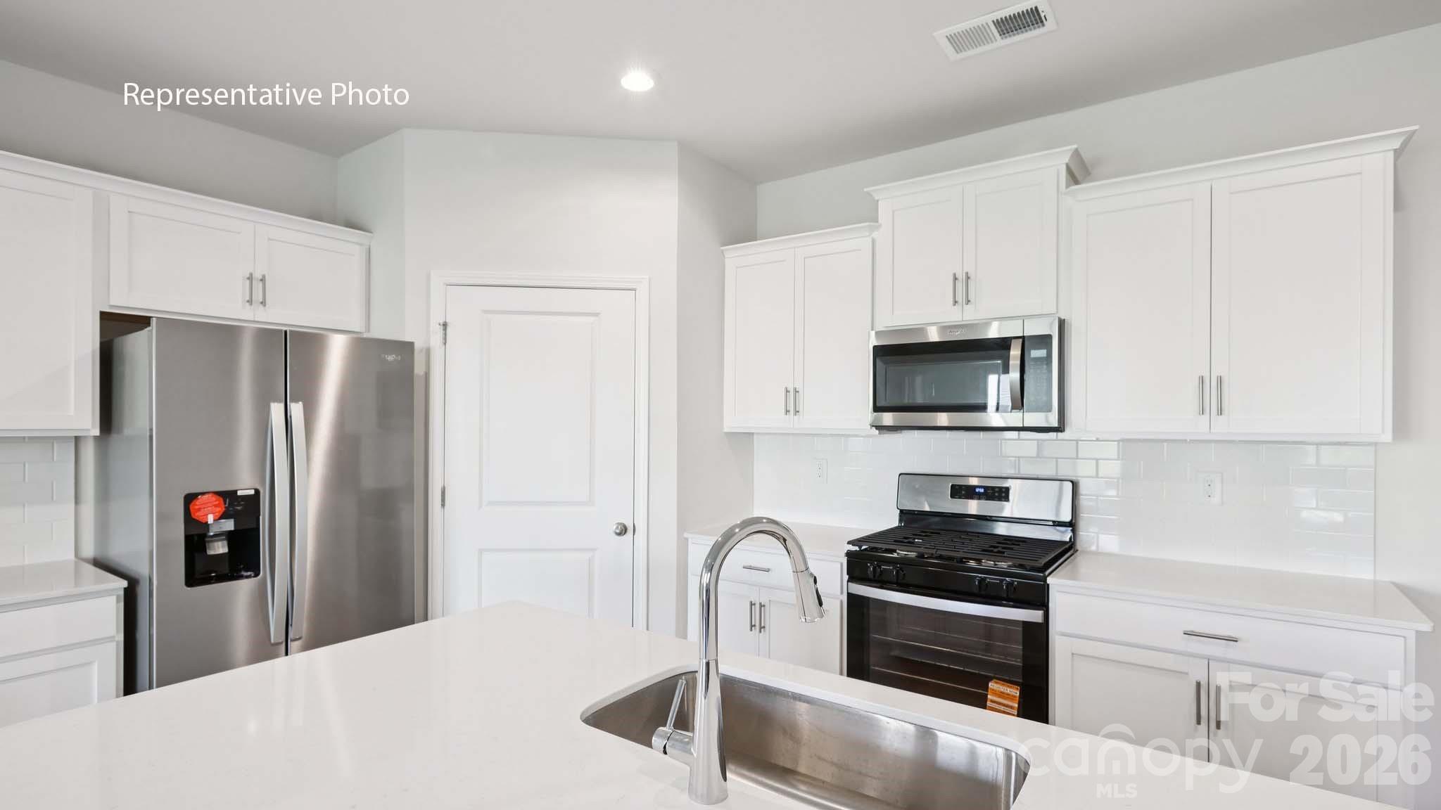 2019 Moorside Court Lancaster, SC 29720 - Photo 7 of 21 a kitchen with stainless steel appliances granite countertop a refrigerator sink and stove