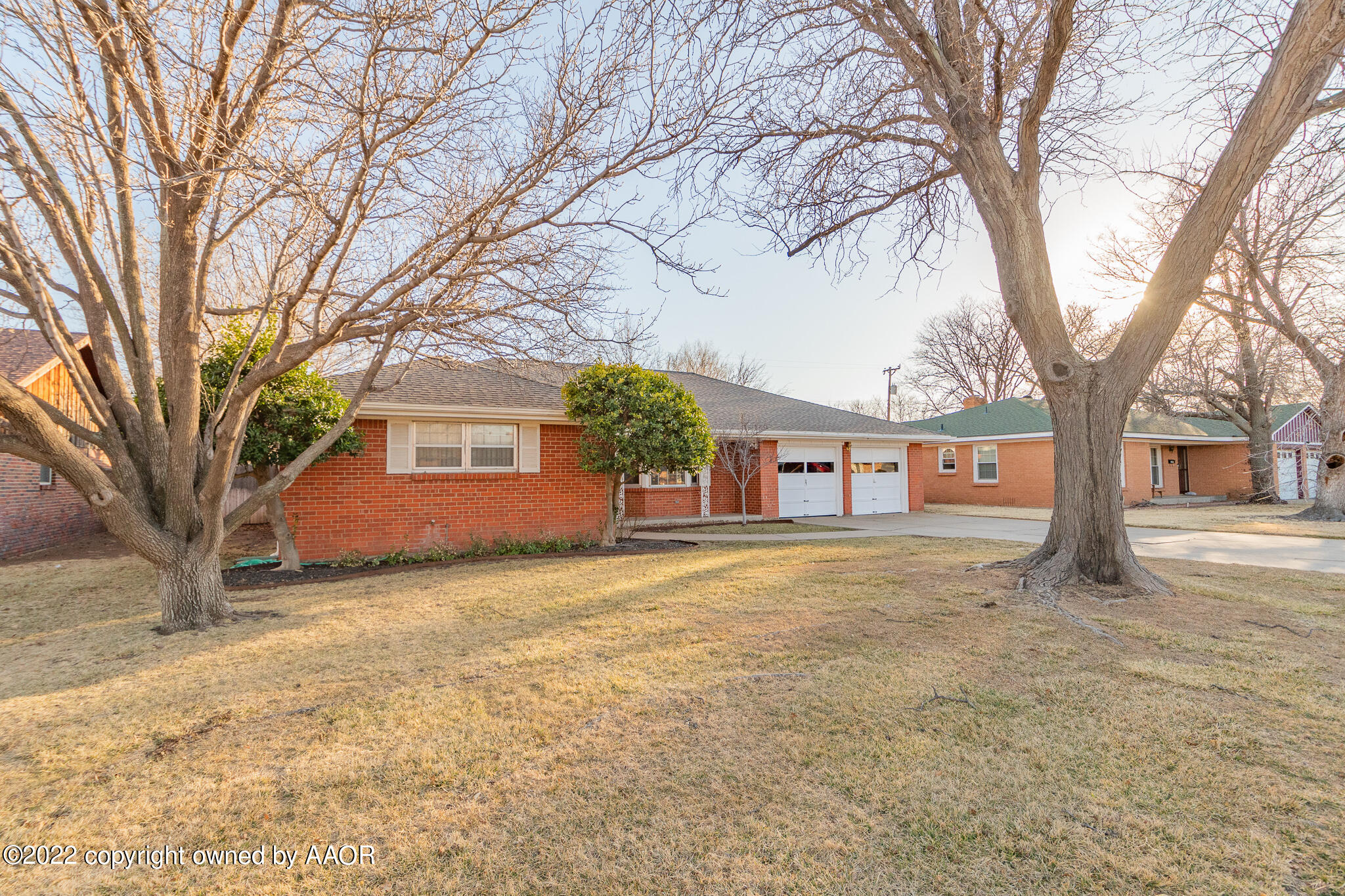 6013 Calumet Road Amarillo, TX 79106 - Photo 1 of 26 a big house with trees in front of it