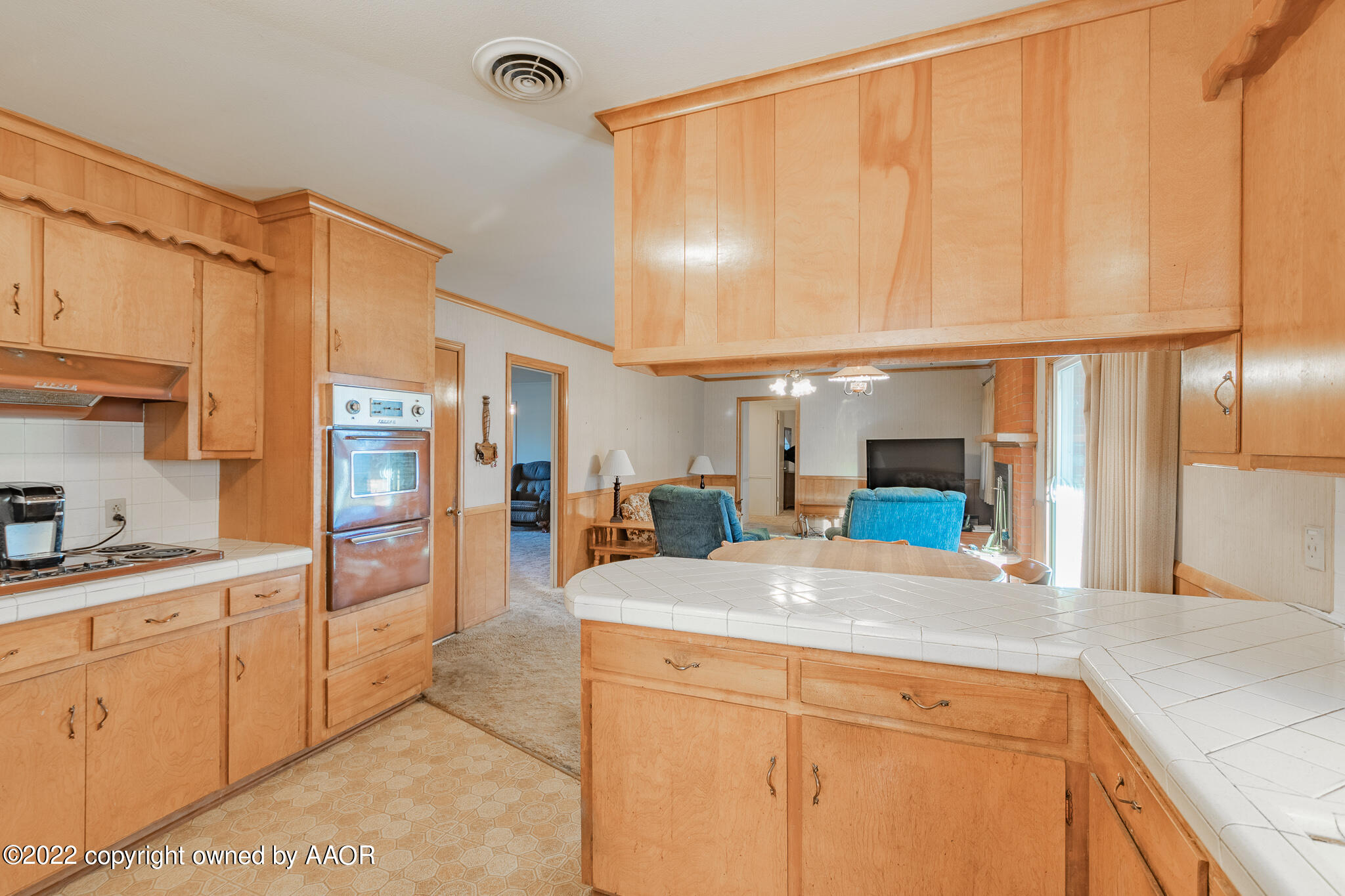 6013 Calumet Road Amarillo, TX 79106 - Photo 11 of 26 a large kitchen with cabinets and furniture