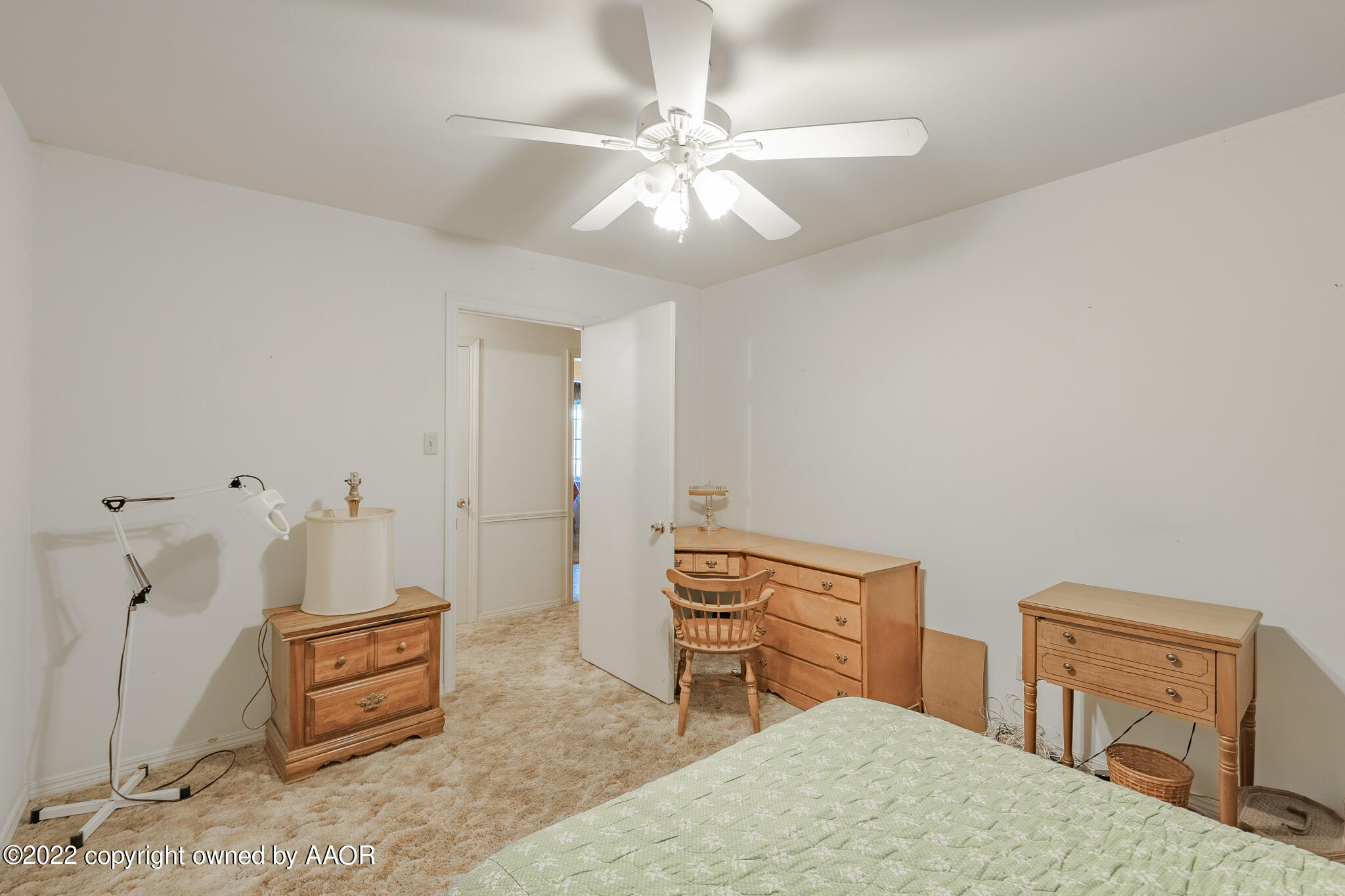 6013 Calumet Road Amarillo, TX 79106 - Photo 17 of 26 a bedroom with furniture and a chandelier fan