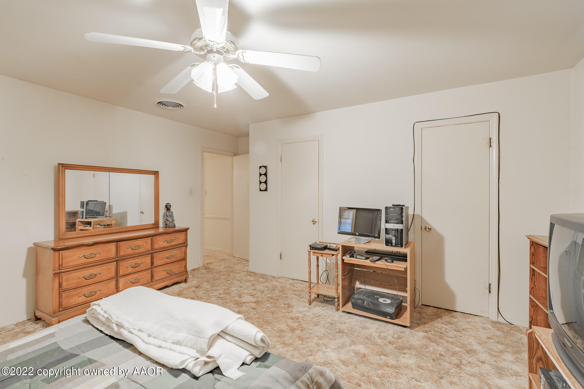 6013 Calumet Road Amarillo, TX 79106 - Photo 21 of 26 a bed room with a bed and a television