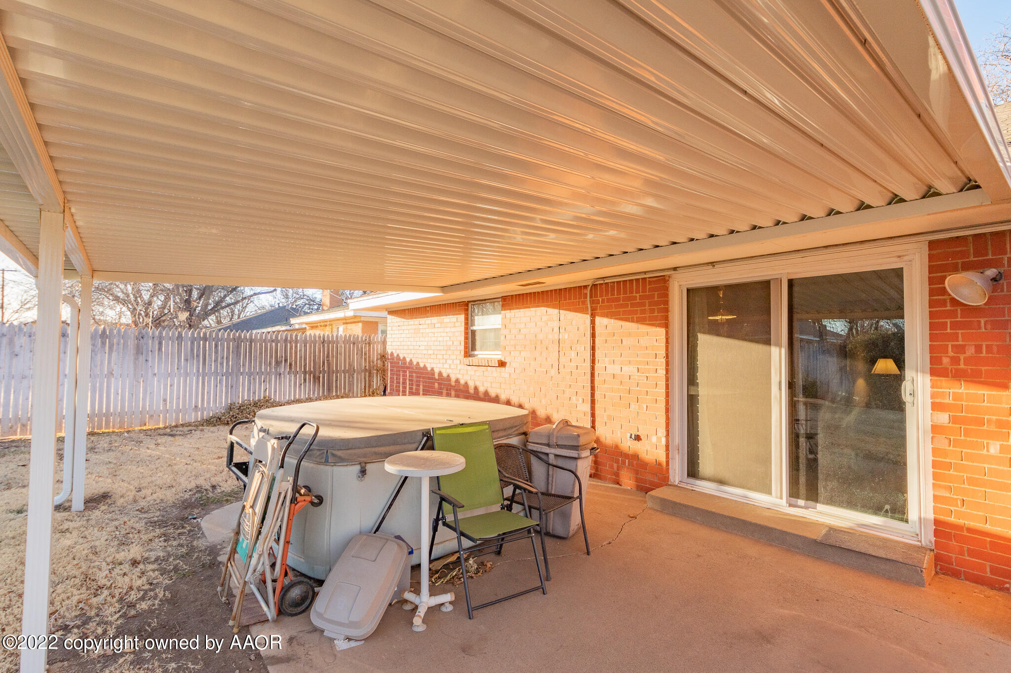 6013 Calumet Road Amarillo, TX 79106 - Photo 23 of 26 a view of a patio with table and chairs