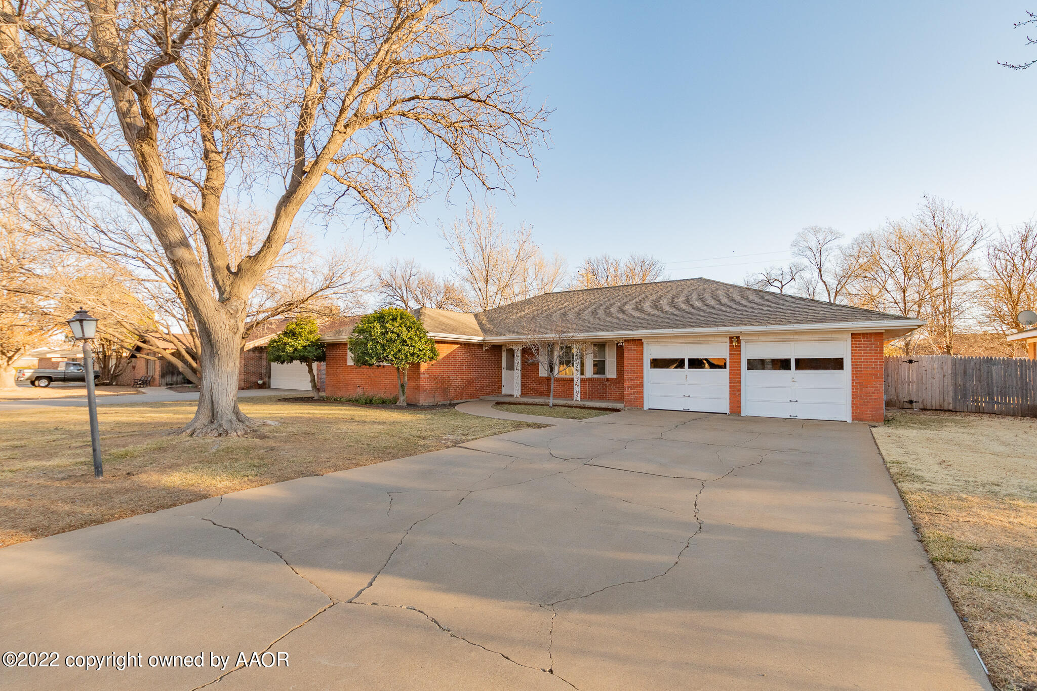 6013 Calumet Road Amarillo, TX 79106 - Photo 3 of 26 a front view of a house with a yard and garage