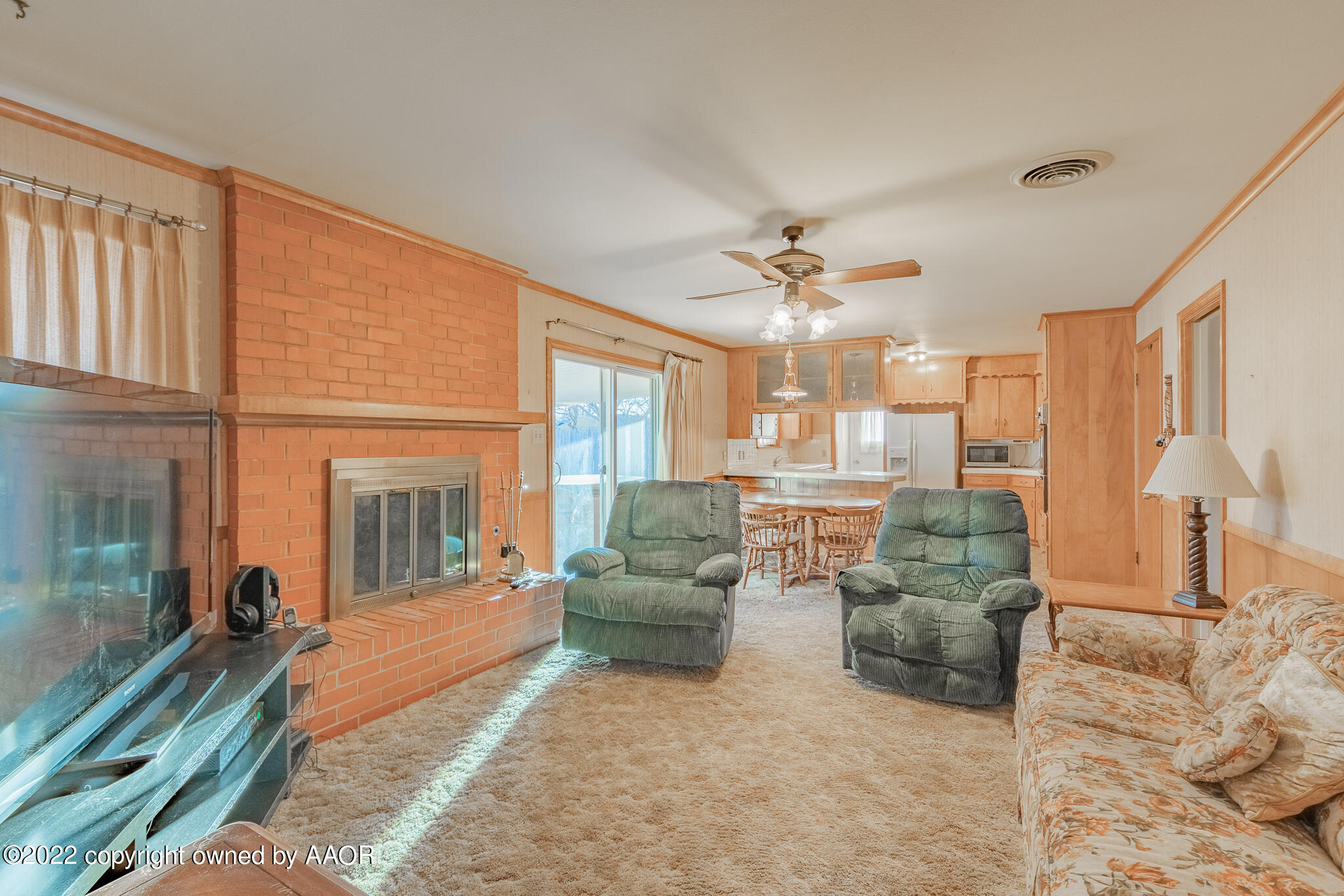 6013 Calumet Road Amarillo, TX 79106 - Photo 7 of 26 a living room with furniture and a chandelier