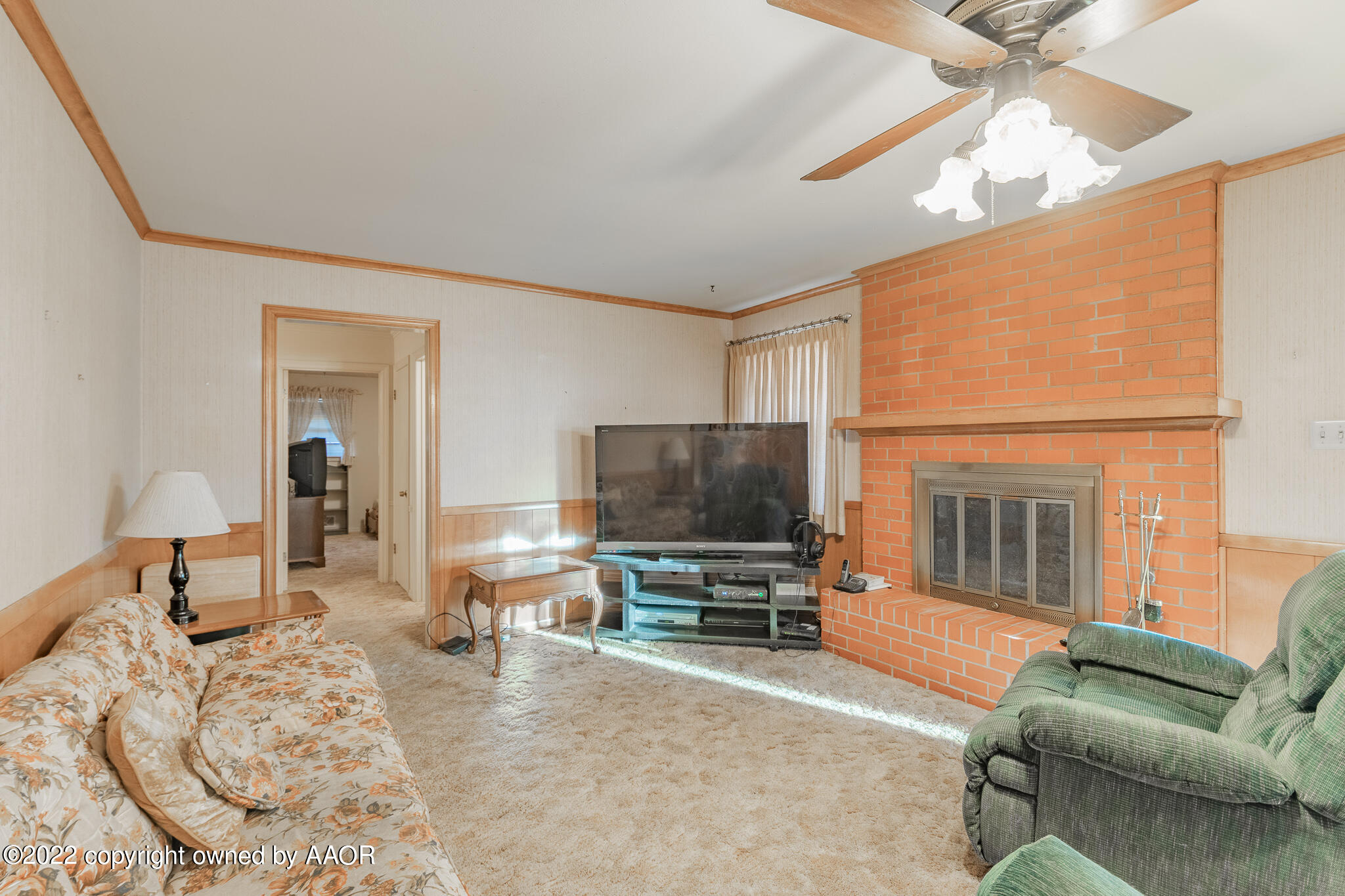 6013 Calumet Road Amarillo, TX 79106 - Photo 8 of 26 a living room with furniture and a flat screen tv