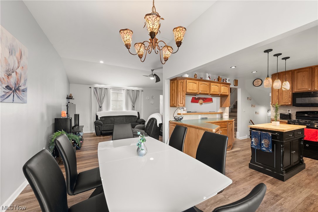 7094 Brandywine Road Parma Heights, OH 44130 - Photo 24 of 49 Dining space featuring an inviting chandelier and light hardwood / wood-style floors