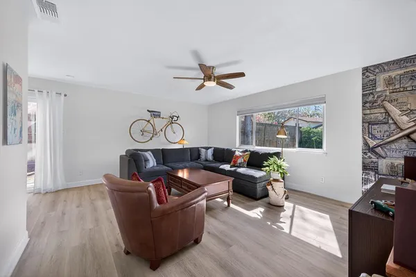 a living room with furniture and a window