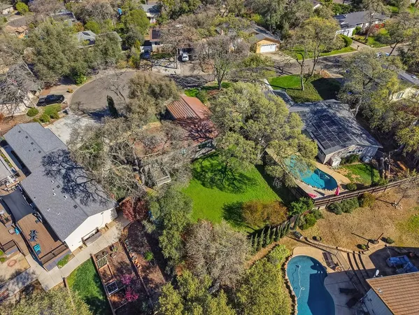 an aerial view of residential house with outdoor space
